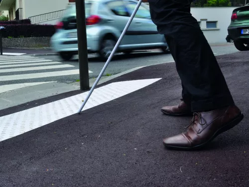 Pedestrian crossing with tactile strip