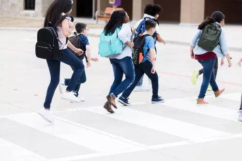 Children crossing a pedestrian crossing